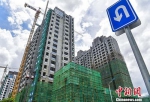 资料图：商品住宅建设工地。 中新社记者 骆云飞 摄 - 西安网