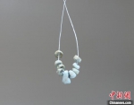 M18出土绿松石串饰。　陕西省考古研究院 摄 - 陕西新闻